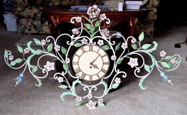 Antique clock with tole polychrome metal frame of vines, flowers and leaves