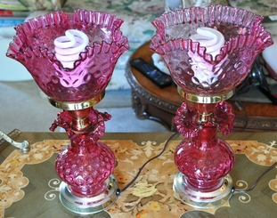 Pair of vintage table lamps with cranberry glass shades
