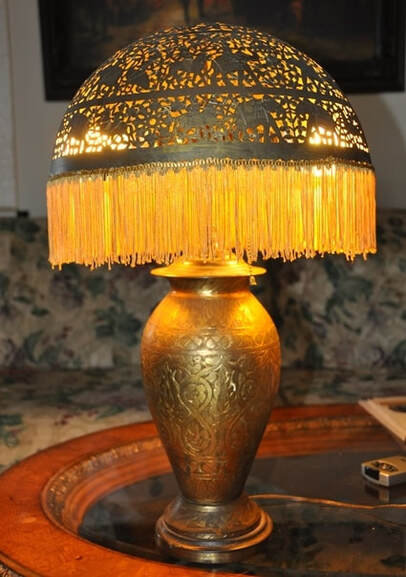 Antique table lamp with pierced brass shade and engraved vase base from India