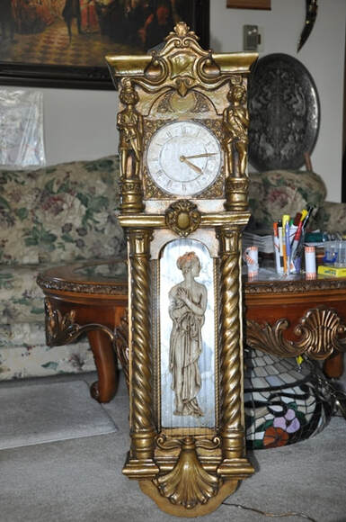 Mid-century wall clock with oil rain fountain lamp and multiple figures