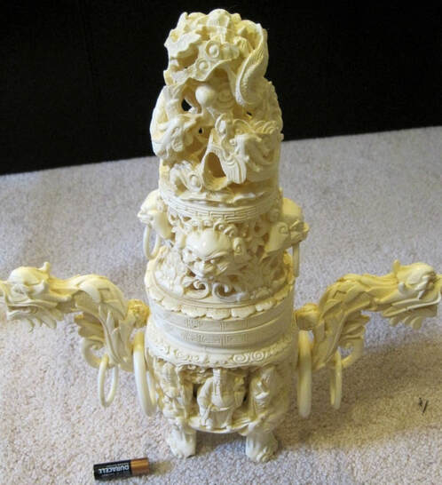 Beautiful faux ivory Asian vase with ornate sculptures
