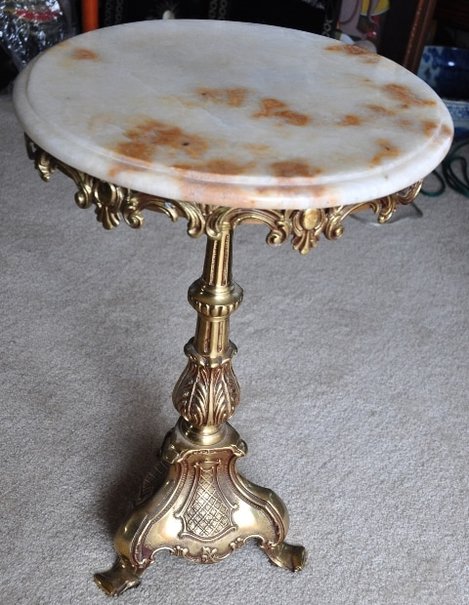 Vintage end table with marble top and ornate brass base