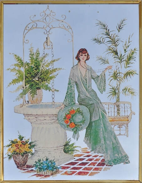 Vintage mirror with artwork depicting a woman in a garden