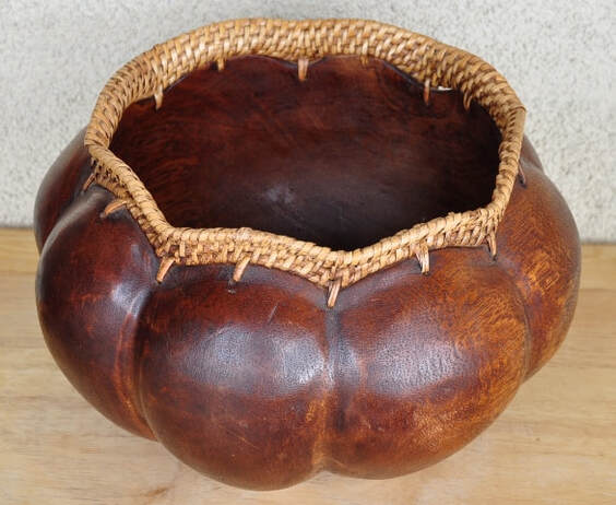 Large hand carved wood and wicker bowl with 8 lobes