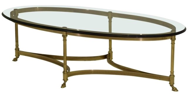 Hollywood Regency coffee table by La Barge with oval glass top and hoof footed brass base