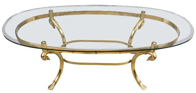Hollywood Regency style oval glass top coffee table with brass swan motif base