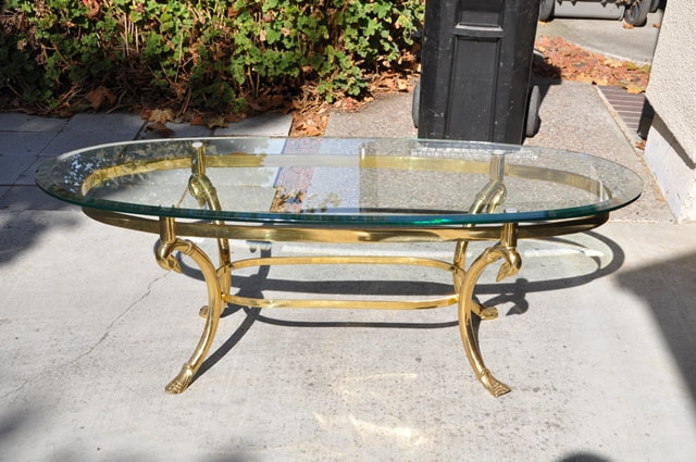 Hollywood Regency style oval glass top coffee table with brass swan motif  base - Assamika: Arts, crafts, antiques, collectibles, home decor and more