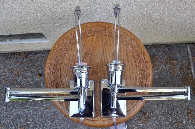 Pair of modern chrome sconces with foldable arms