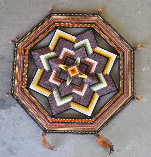Native American octagonal dream catcher with geometric design