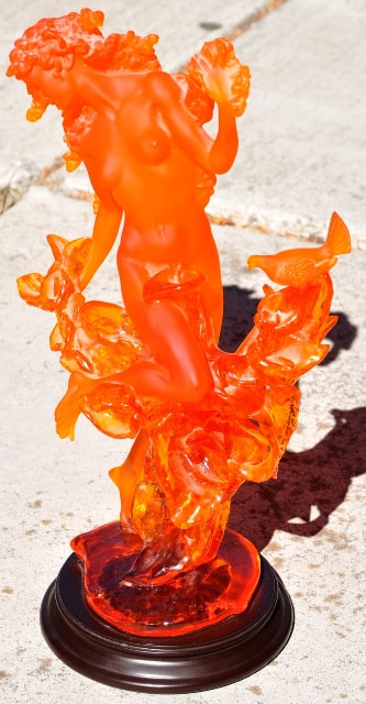 Pâte de verre style amber colored resin sculpture of a woman and a bird