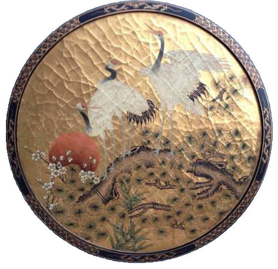 Japanese circular lacquer painting depicting white cranes on a pine tree