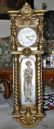 Mid-century wall clock with oil rain fountain lamp and multiple figures