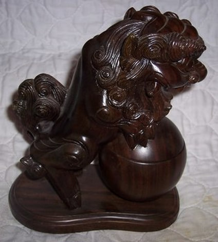 Wood sculpture of Foo dog censer with pearl of wisdom