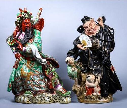 Pair of Chinese porcelain sculptures of Guangong and an official