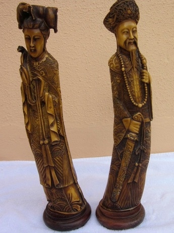 Pair of faux ivory Oriental sculptures of emperor empress