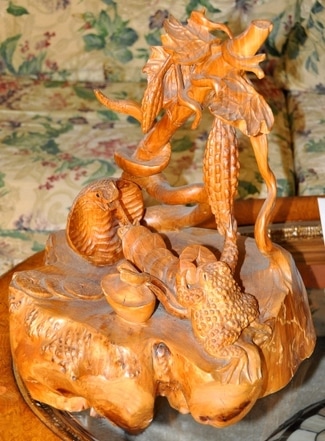 Burl wood sculpture of cobra and frog with gold coins