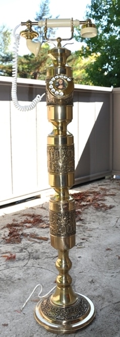 Tall French style brass telephone with ornate design