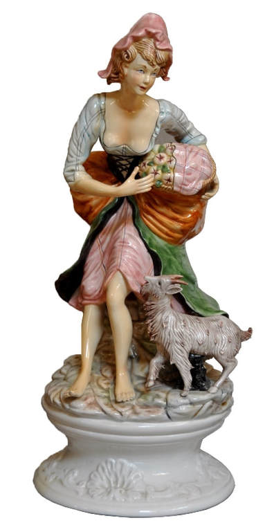 Vintage porcelain sculpture of a peasant girl with her goat