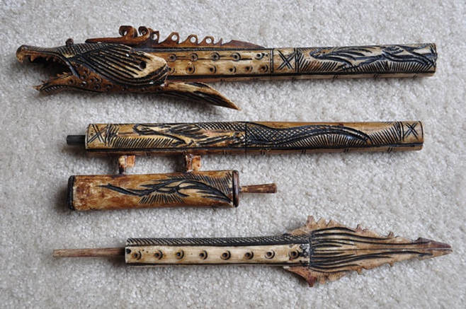Indonesian dragon shaped carved bone blow dart gun from Borneo