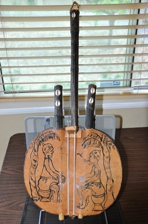 Antique Kora (stringed musical instrument) with artwork from West Africa