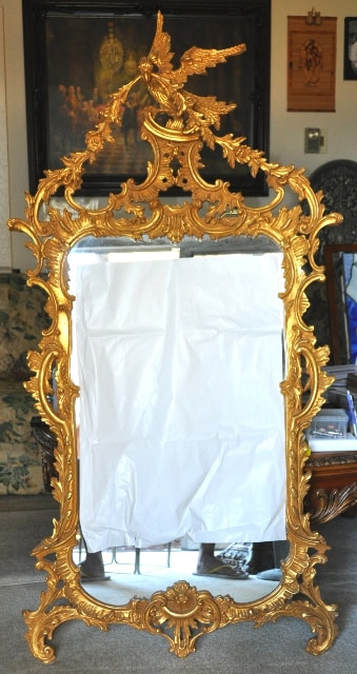 Mid-century Italian mirror in gilded wood carved ornate frame with Phoenix