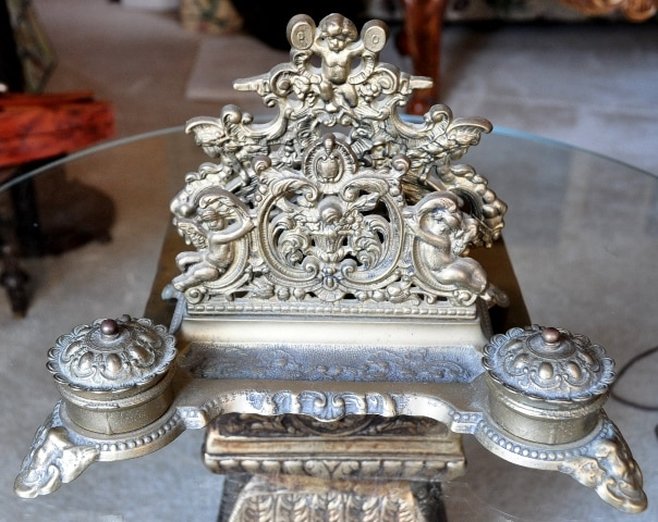 Ornate brass desk set with letter holder and inkwells