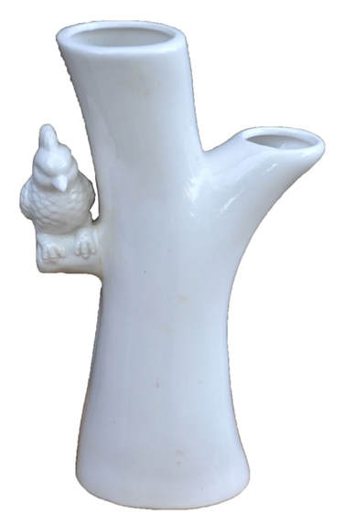 White porcelain tree trunk bud vase with a bird sitting on a branch