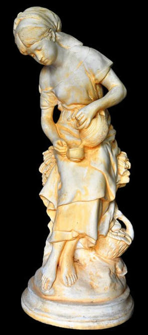 Sculpture of a milkmaid pouring milk