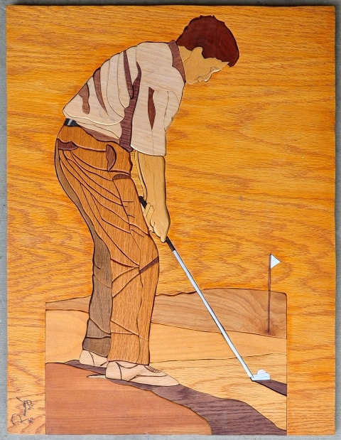 Randy Wilke wood inlay artwork depicting a golfer