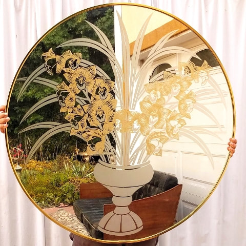 Round mirror with etched cymbidium bouquet artwork by Robert Slimbach