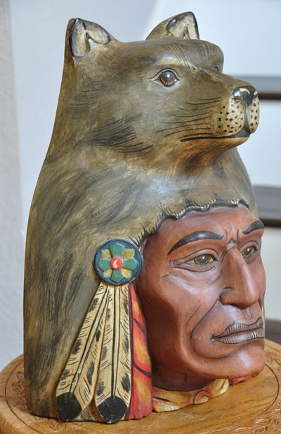 Rare wood carving of a Native American head with a wolf headdress