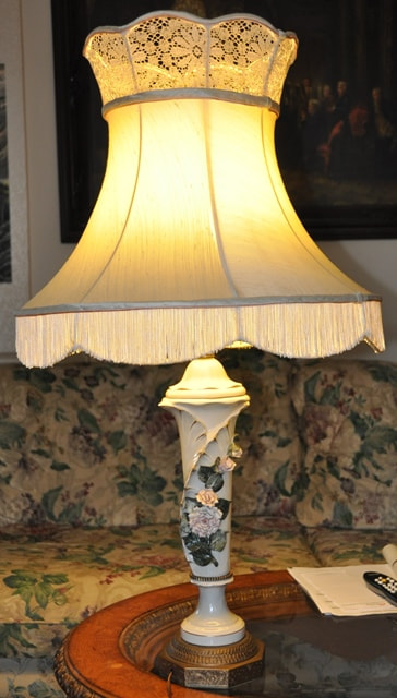 Table lamp with floral ceramic base and silk shade