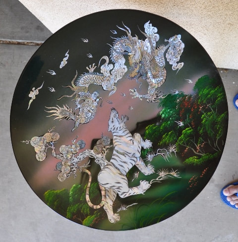 Vietnamese charger with mother of pearl inlay depicting tiger and dragon
