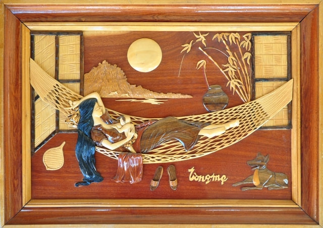Vietnamese intarsia wood art depicting mother and child on a hammock