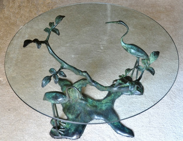 Bronze base coffee table in the style of Willy Daro with two cranes near a tree